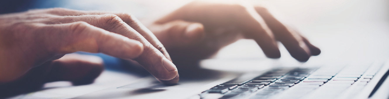 Person using a laptop to bank online.